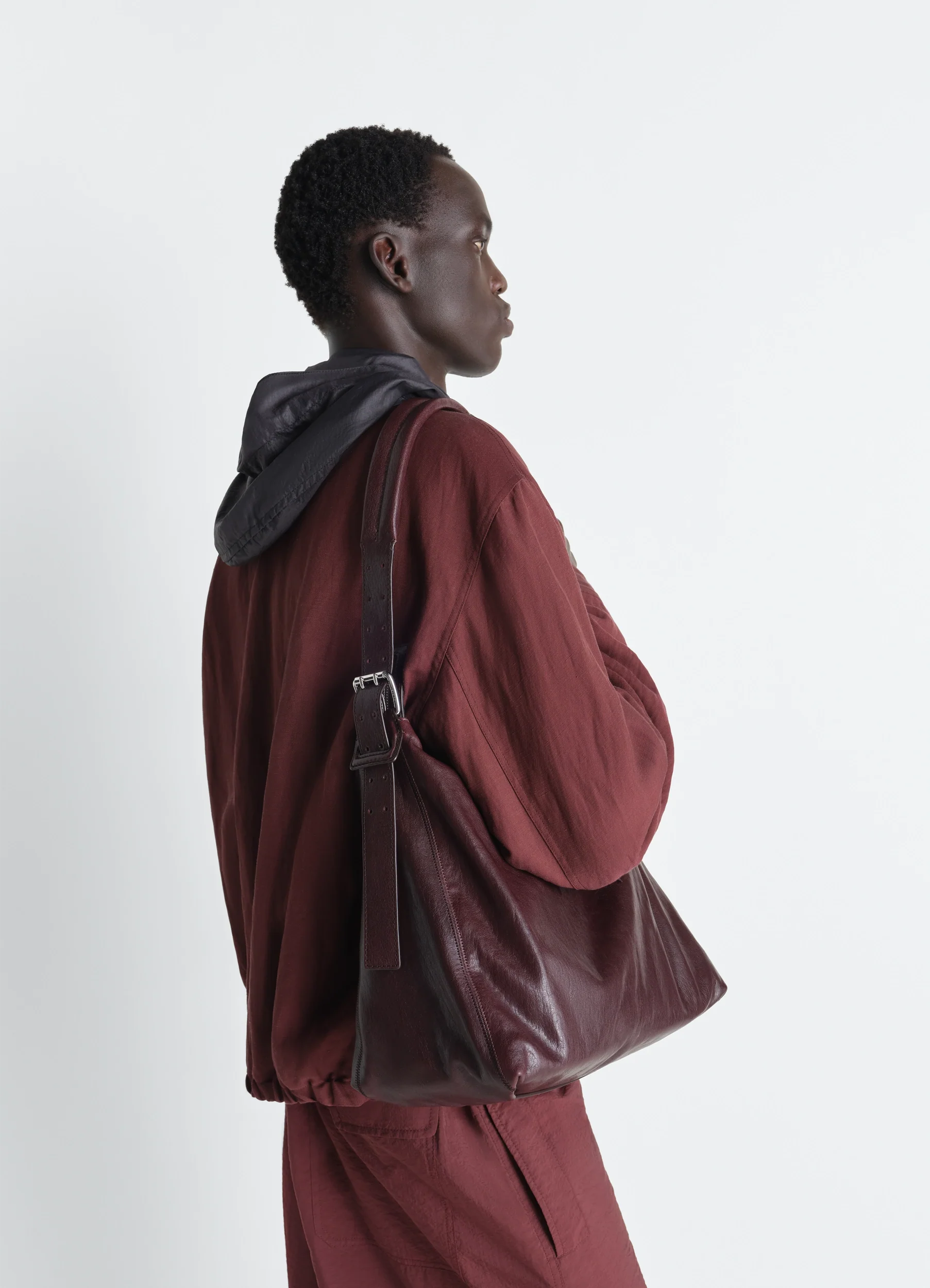 SMALL BELTED HOBO BAG IN LEATHER