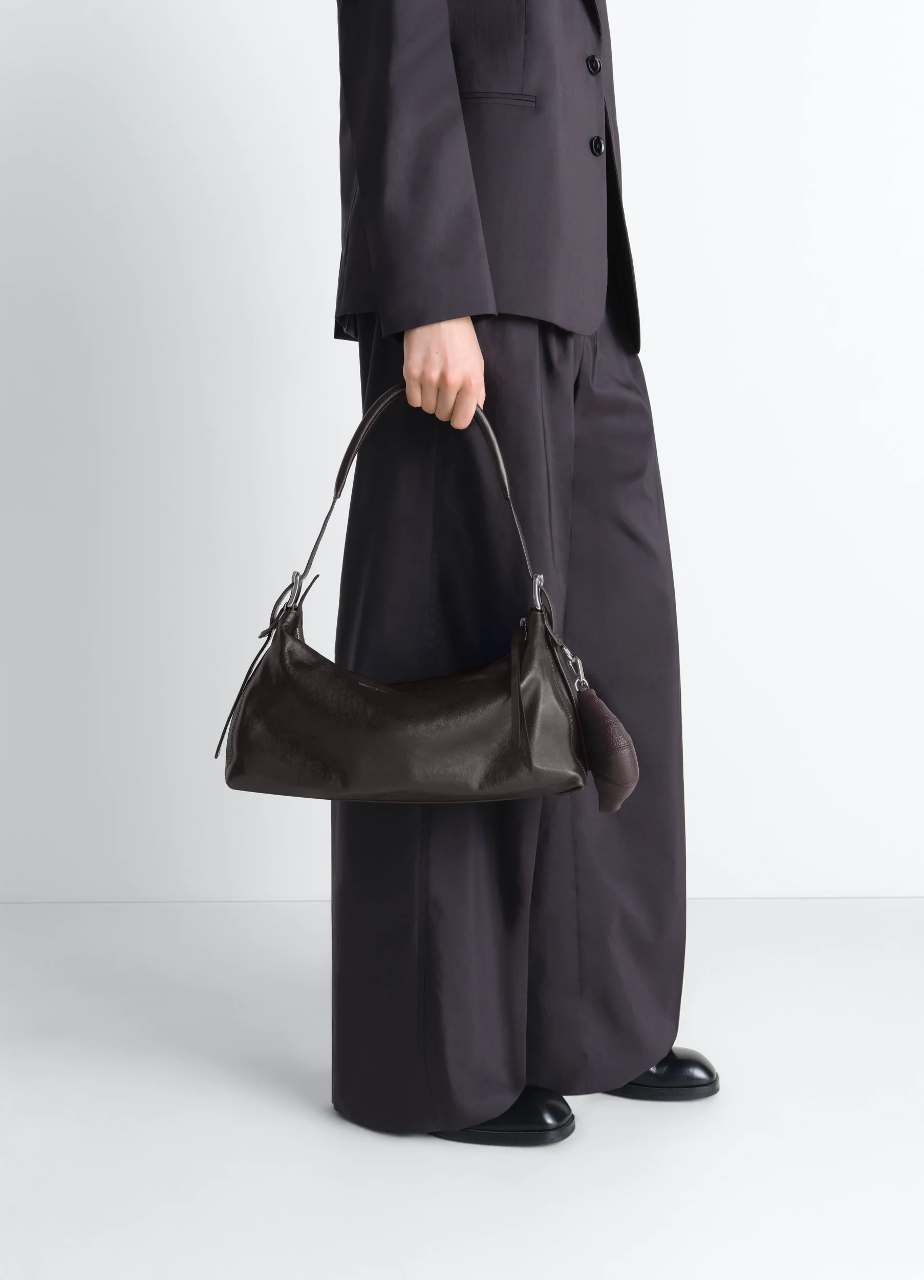 BELTED BAGUETTE BAG IN LEATHER