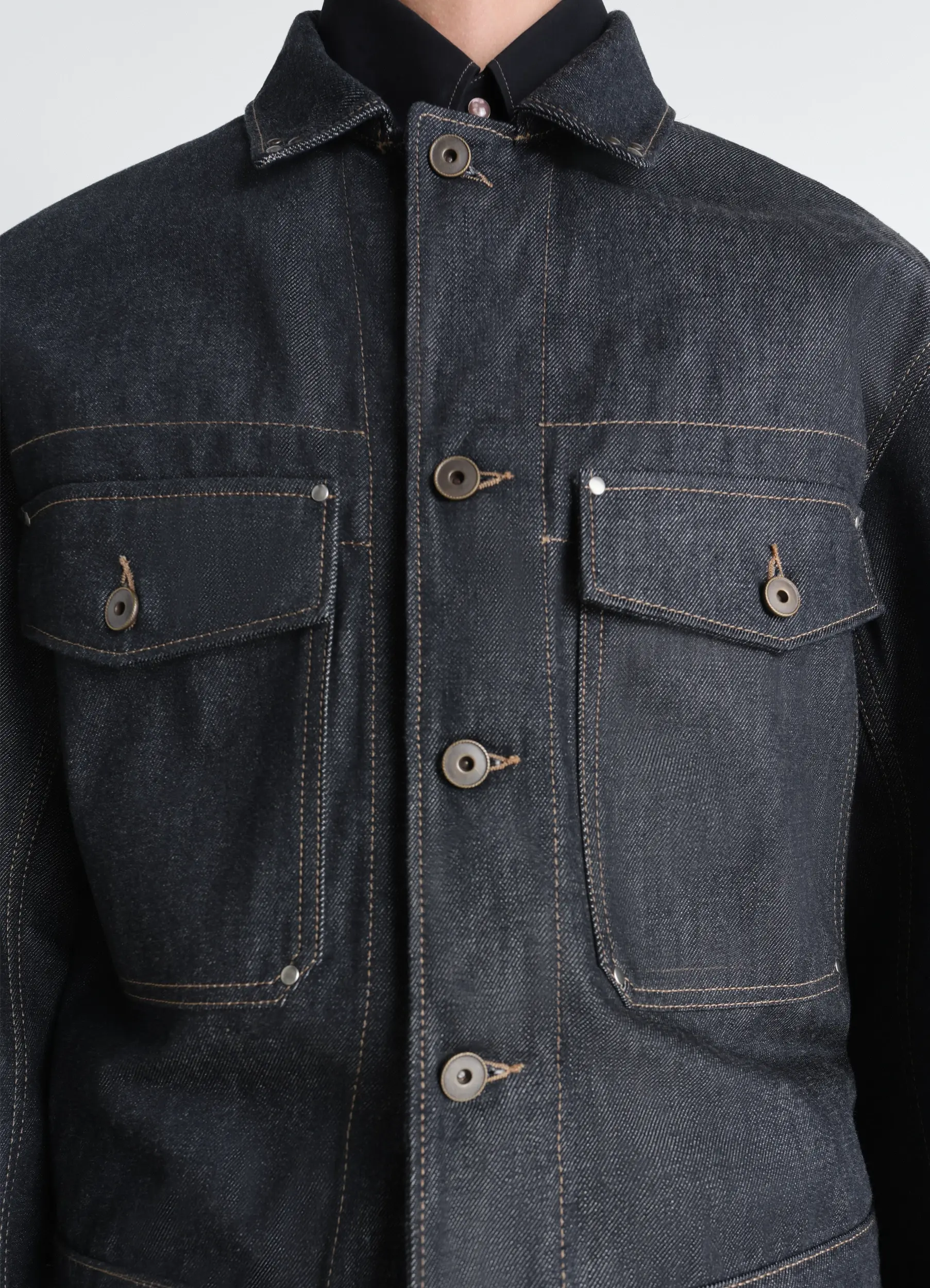 TRUCKER JACKET WITH STUDS IN DENIM