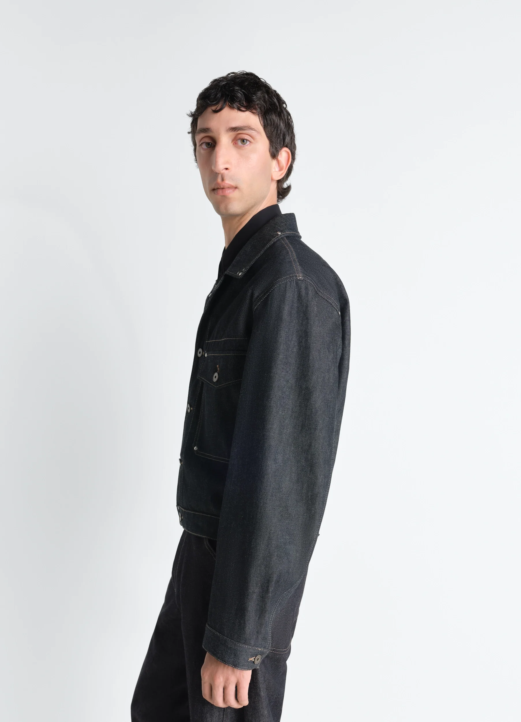 TRUCKER JACKET WITH STUDS IN DENIM
